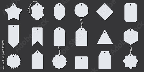 Blank white paper price tags or gift tags in different shapes. Set of various tags with cord.
