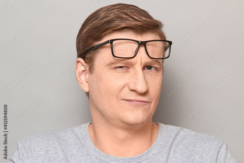 Portrait of happy blond mature man with glasses raised on forehead Portrait of happy blond mature man with glasses raised on forehead