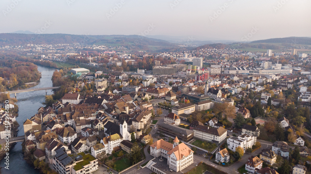 Drone view of cityscape Brugg with Aare river, residential and commercial districts, historic old town and casino bridge in canton Aargau in Switzerland. Town situated on feet of Tafeljura. Drone view of cityscape Brugg with Aare river, residential and commercial districts, historic old town and casino bridge in canton Aargau in Switzerland. Town situated on feet of Tafeljura.