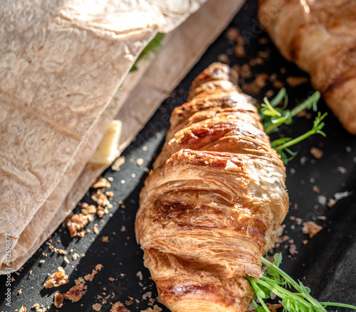 Croissant and pita with cheese, microgreen sprouts photo