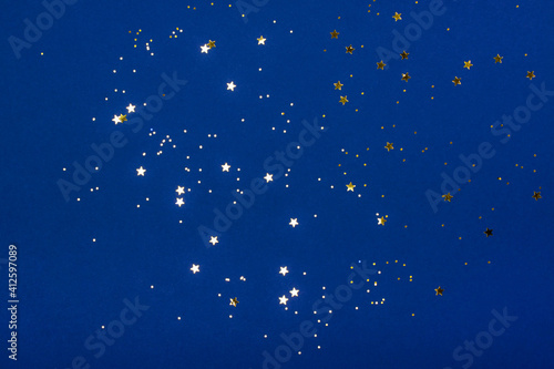 Trendy blue background with stars. The concept of celebrations, the Day of St. Valentine, Christmas, New Year, holiday, birthday, etc.