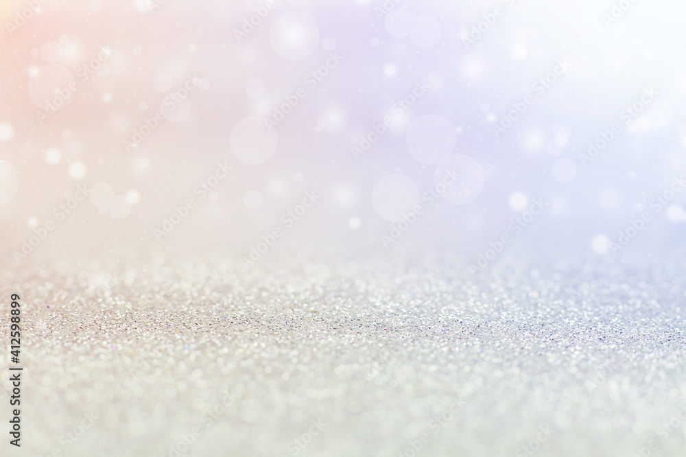 Silver background, bokeh with colored highlights. Silver background, bokeh with colored highlights.