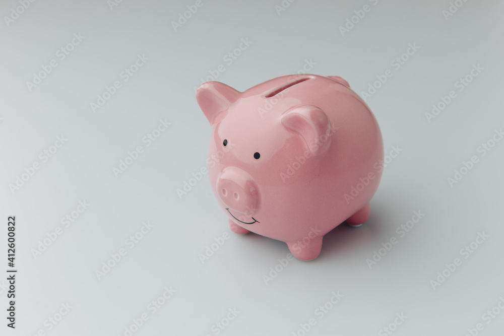 Pink piggy bank on a white background. Finance, saving money concept.