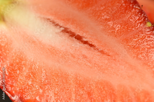 Natural juicy strawberries, in a section, close-up.