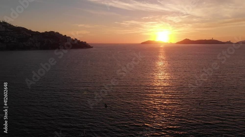 Beautiful view of the beach, aerial view of the beach, acapulco beach seen from above. Travel and vacation concept. Colorful sunset on the beach. Aerial video