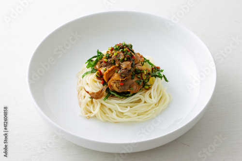 Korean food, Komak Bibimmyeon which is mixed with noodle, vegetables and blood cockle photo