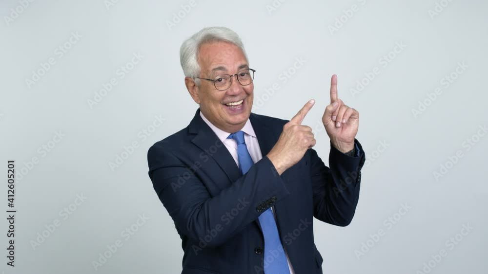 Middle age businessman pointing a great idea and looking up over isolated background Middle age businessman pointing a great idea and looking up over isolated background