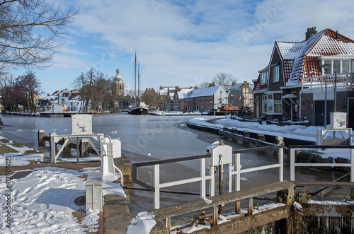 Canals and lock in winter in Meppel Drenthe Netherlands. Frost and snow. View at the city of Meppel. © A