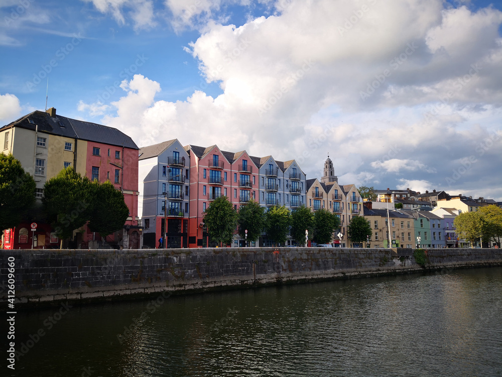 Beautiful landscape in Cork, Ireland with colorful houses by river Lee on  a summer, sunny day.