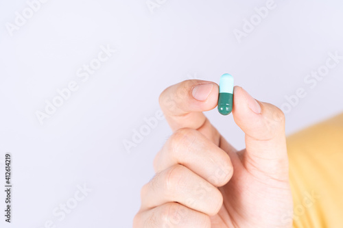 Close up hands holding pill drugs. Healthcare and medical pharmacy concept.