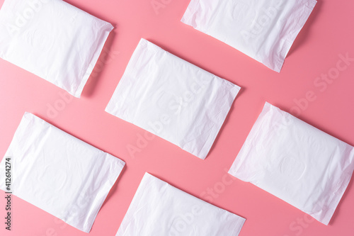Pattern of Sanitary pad, Sanitary napkin on pink background. Menstruation, Feminine hygiene, top view.