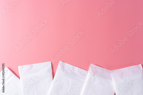 Fototapeta Naklejka Na Ścianę i Meble -  Sanitary pad, Sanitary napkin on pink background. Menstruation, Feminine hygiene, top view.