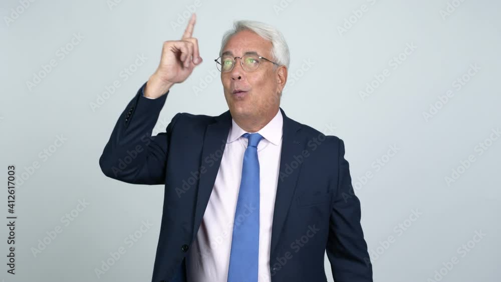 Middle age businessman intending to realizes the solution while lifting a finger up over isolated background Middle age businessman intending to realizes the solution while lifting a finger up over isolated background