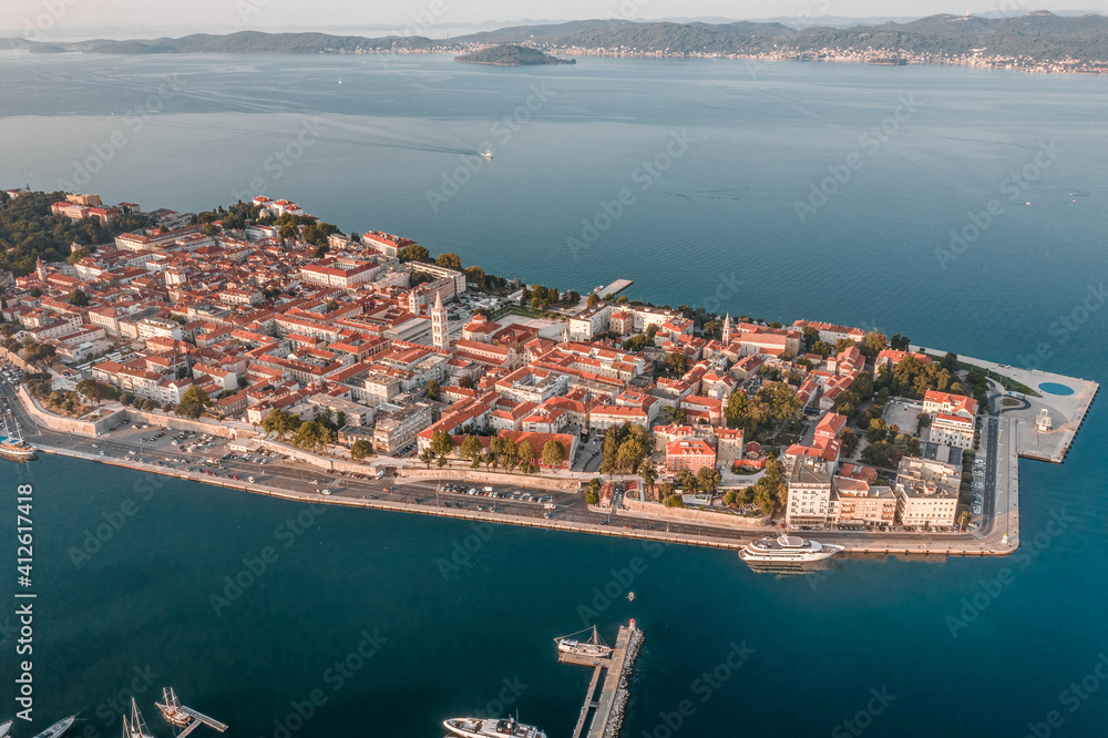 Aerial drone shot of Zadar old town peninsula with sea organ in sunrise in Croatia Dalmatia