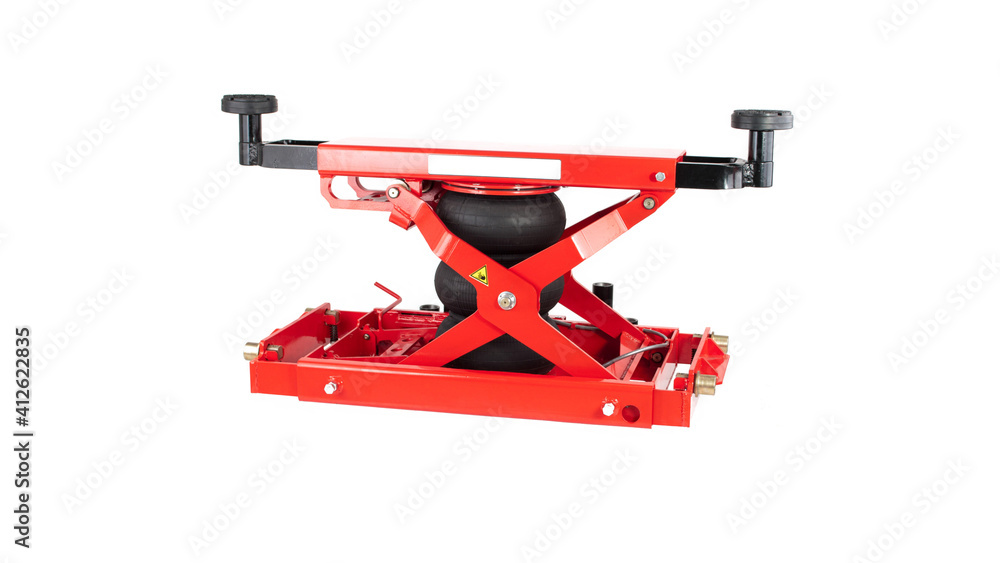 Red car traverse for repair and lifting of equipment in working form on a white background, isolation