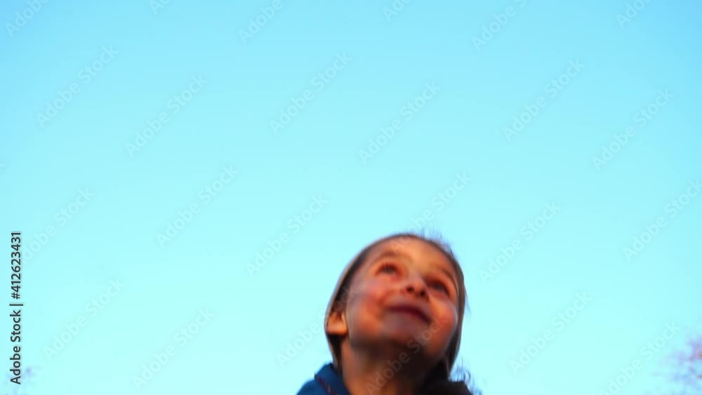 Funny, cheerful cute little girl throwing up a yellow autumn leaves in slow motion. Back to school
Funny, cheerful cute little girl throwing up a yellow autumn leaves in slow motion. Back to school
