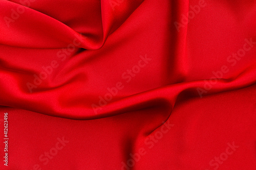 Red silk or satin luxury fabric texture background