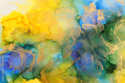 art photography of abstract fluid art painting with alcohol ink, blue, green, yellow and gold colors © tomertu
