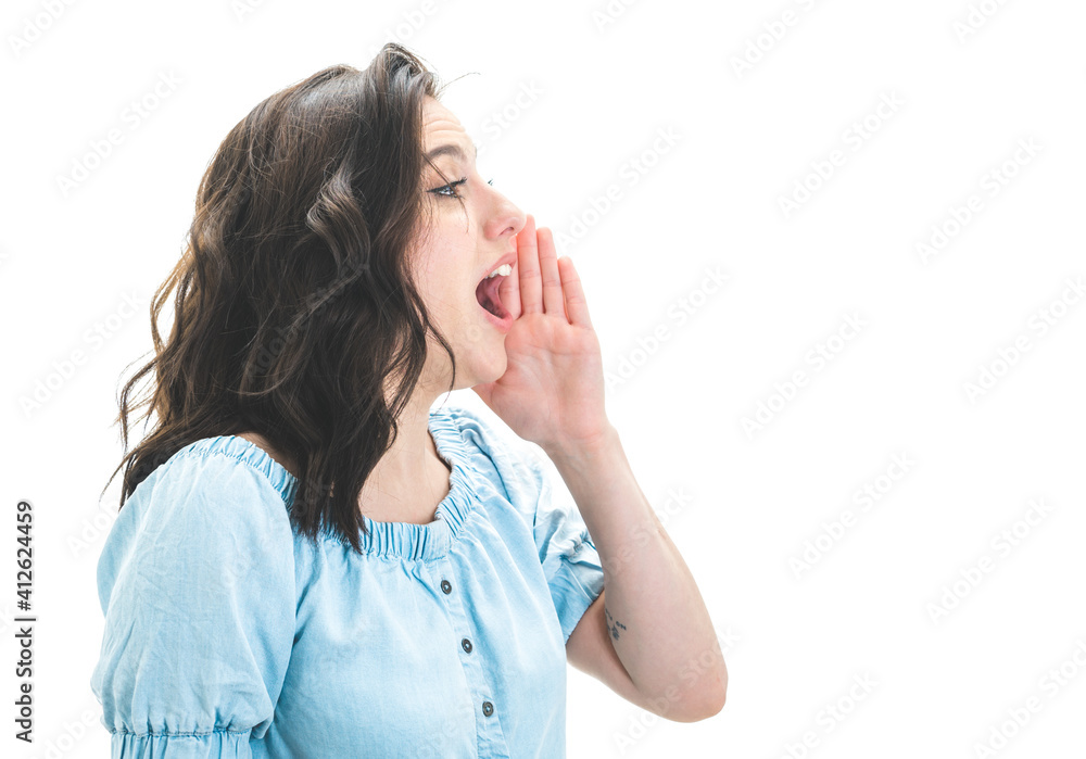 Young woman yelling, isolated on white background. Side view of pretty girl while says something Young woman yelling, isolated on white background. Side view of pretty girl while says something