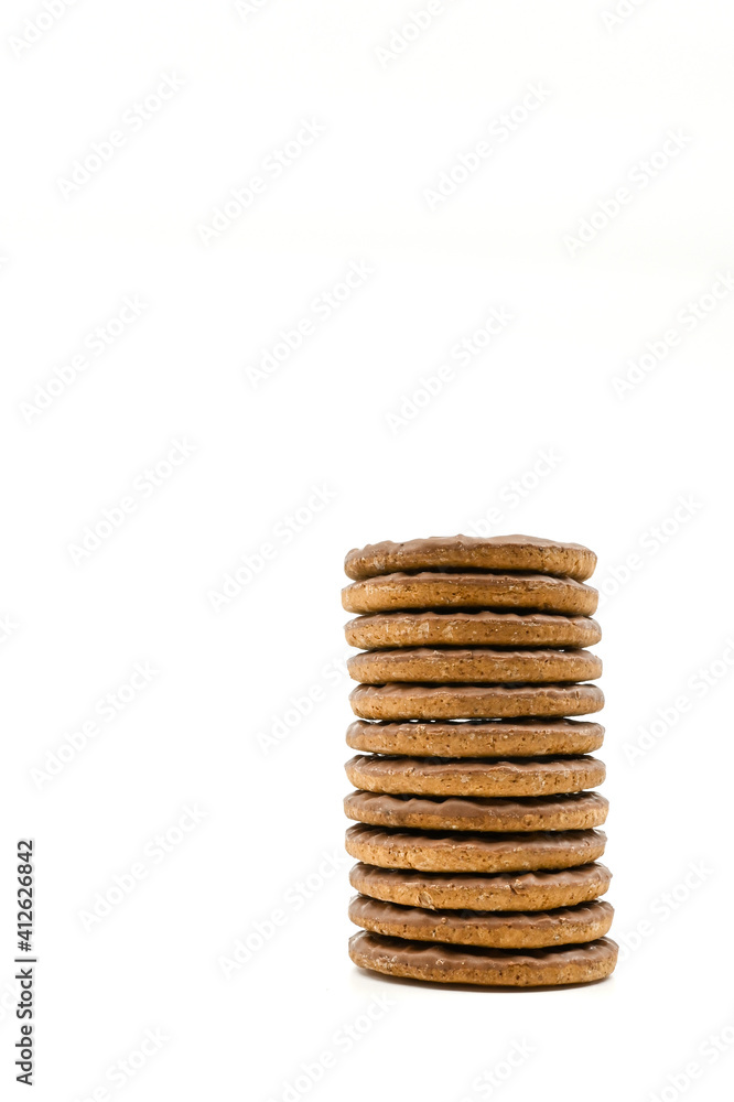 Stack of chocolate covered biscuits against a plain white background. No people. Copy space. Stack of chocolate covered biscuits against a plain white background. No people. Copy space.