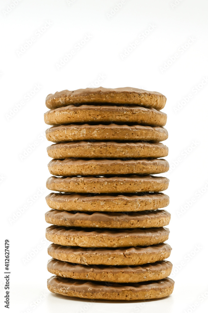 Stack of chocolate covered biscuits against a plain white background. No people. Copy space. Stack of chocolate covered biscuits against a plain white background. No people. Copy space.