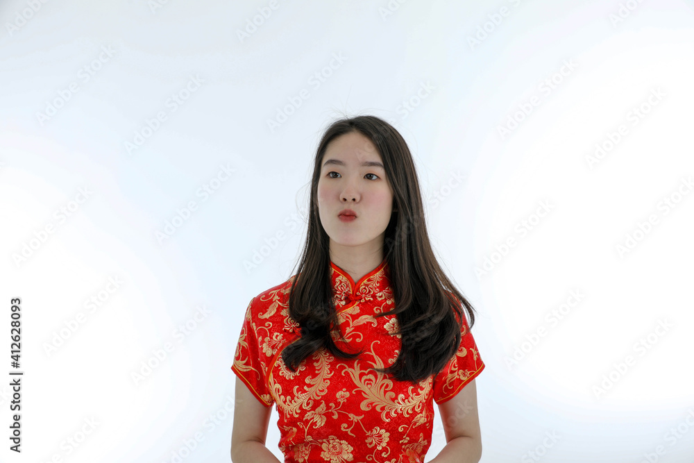 Asian young pretty woman wearing red Chinese Traditional dress for New year celebration and Valentine Asian young pretty woman wearing red Chinese Traditional dress for New year celebration and Valentine