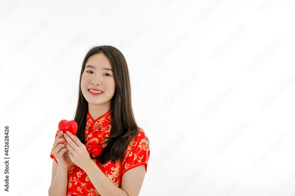 Asian young pretty woman wearing red Chinese Traditional dress for New year celebration and Valentine Asian young pretty woman wearing red Chinese Traditional dress for New year celebration and Valentine