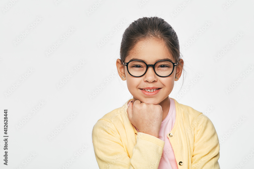 Vision, correction, children., Smiling, Latino, child, stylish, eyeglasses, isolated, light, grey, background Vision, correction, children., Smiling, Latino, child, stylish, eyeglasses, isolated, light, grey, background