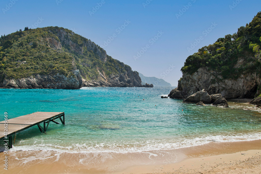 The beautiful pristine beach at Corfu island , Greece