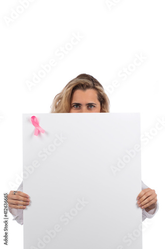 Caucasian doctor woman with pink stethoscope holding card