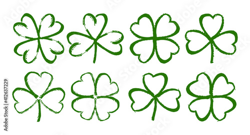Sketch line clover. Set of Hand drawn brush shamrocks on white background.