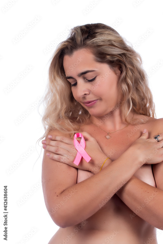woman covering breasts with hands with pink ribbon woman covering breasts with hands with pink ribbon