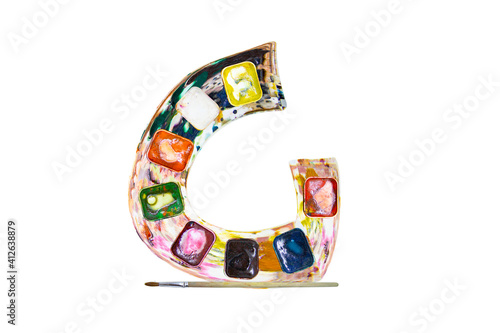 Font, a letter G made of watercolors and paints