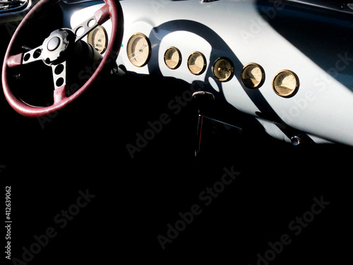 High Angle View Of Vintage Car Instrument Panel With Shadows