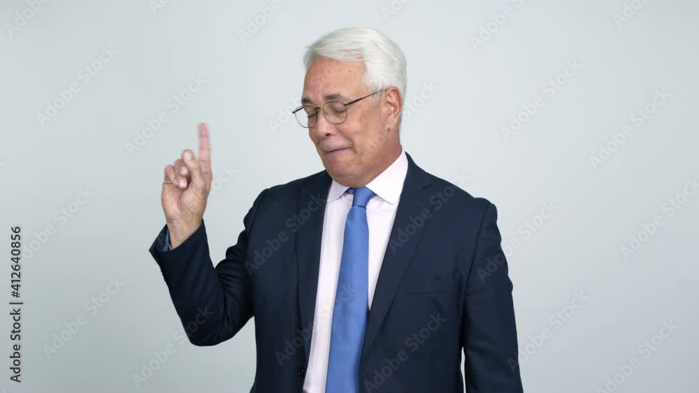 Middle age businessman doing NO gesture over isolated background Middle age businessman doing NO gesture over isolated background