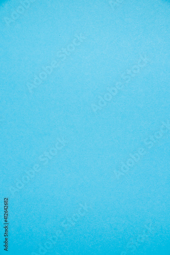 Background with copy space. Colored blue paper or cardboard with space for text, vertical format