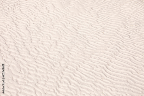 White sand ripples texture. Desert  beach  ripple shape on sandy surface.