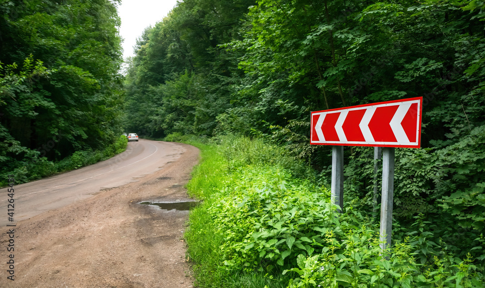 Forest road shoulder and turn sign Forest road shoulder and turn sign