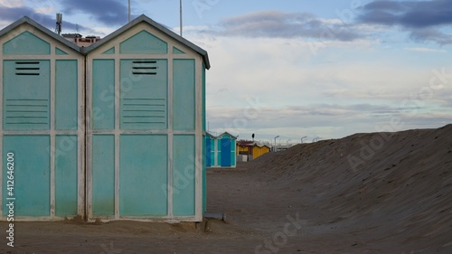 Blue beach sheds near a sand dune on the Mediterranean sea coast (Pesaro, Italy, Europe) © Tommaso