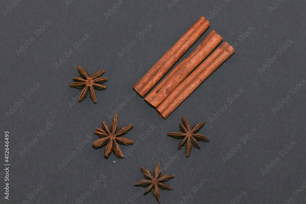 Cinnamon, anise, and coffee beans isolated on a black background. Cinnamon, anise, and coffee beans isolated on a black background.