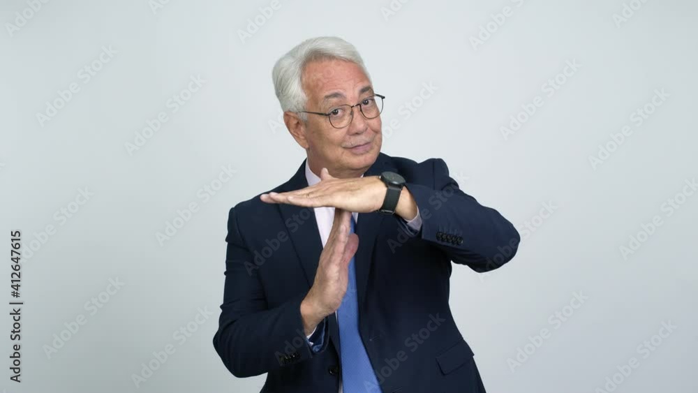 Middle age businessman doing time out gesture over isolated background Middle age businessman doing time out gesture over isolated background