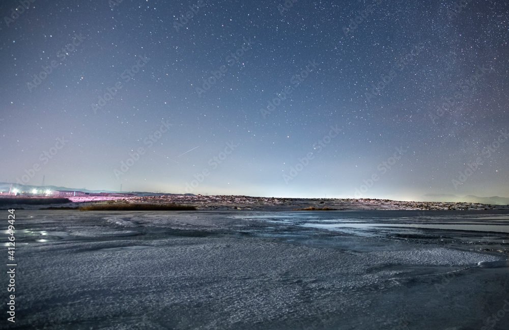Winter landscape, beautiful frozen lake in night under starry sky. Winter landscape, beautiful frozen lake in night under starry sky.
