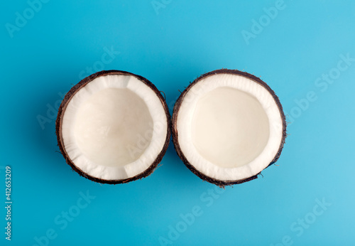 Coconuts on a blue isolate background. Coconut minimal concept