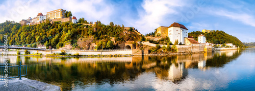 Gran panorama of the Inn shore and historic old town of Passau on a beautiful summer day, Germany