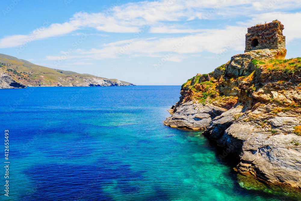 On the island of Andros, in the Cyclades archipelago, in the heart of the Aegean Sea, the old Venetian castle, on the islet connected to the city by a stone bridge, protected the city