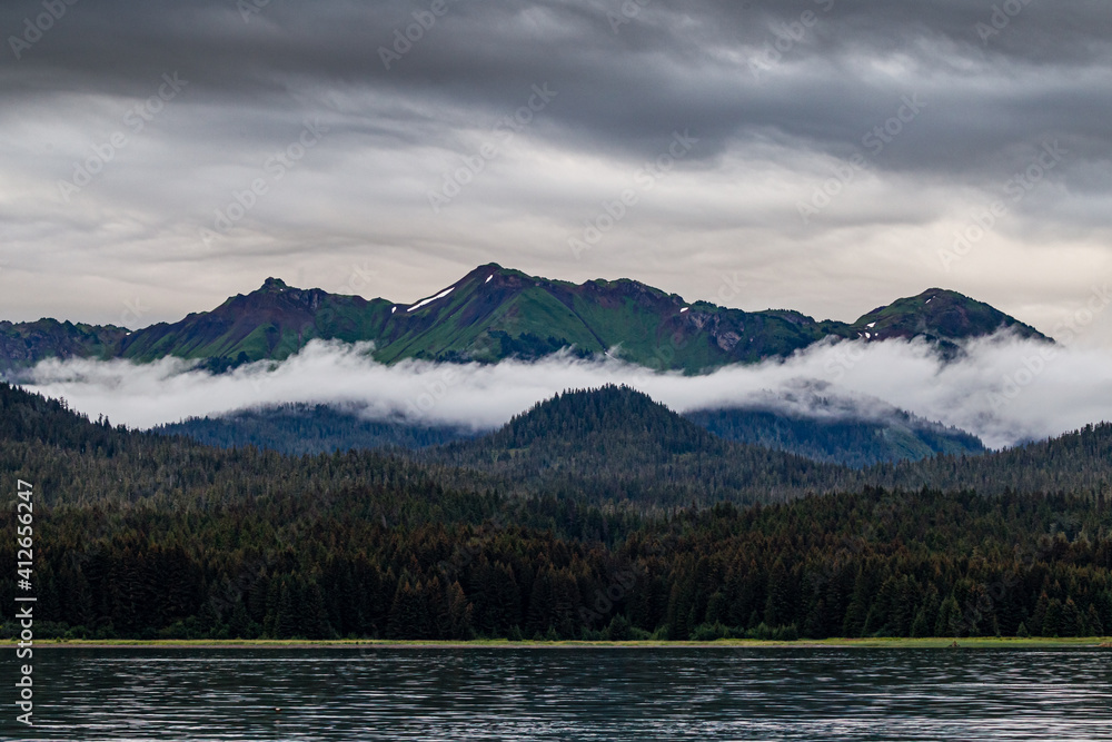 Mist between the mountains of Alaska in Summer