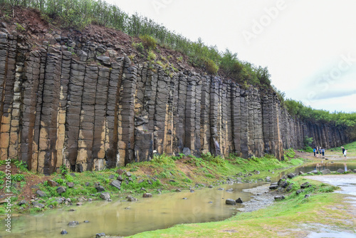 Terracotta columnar basalt columns on the tropical island of Penghu Taiwan. Geological lava plateau. photo