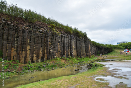 Terracotta columnar basalt columns on the tropical island of Penghu Taiwan. Geological lava plateau.