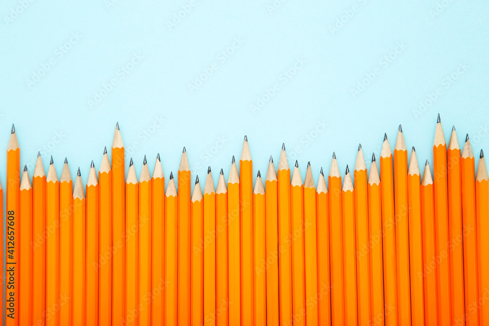 Obraz premium Yellow pencils on blue background