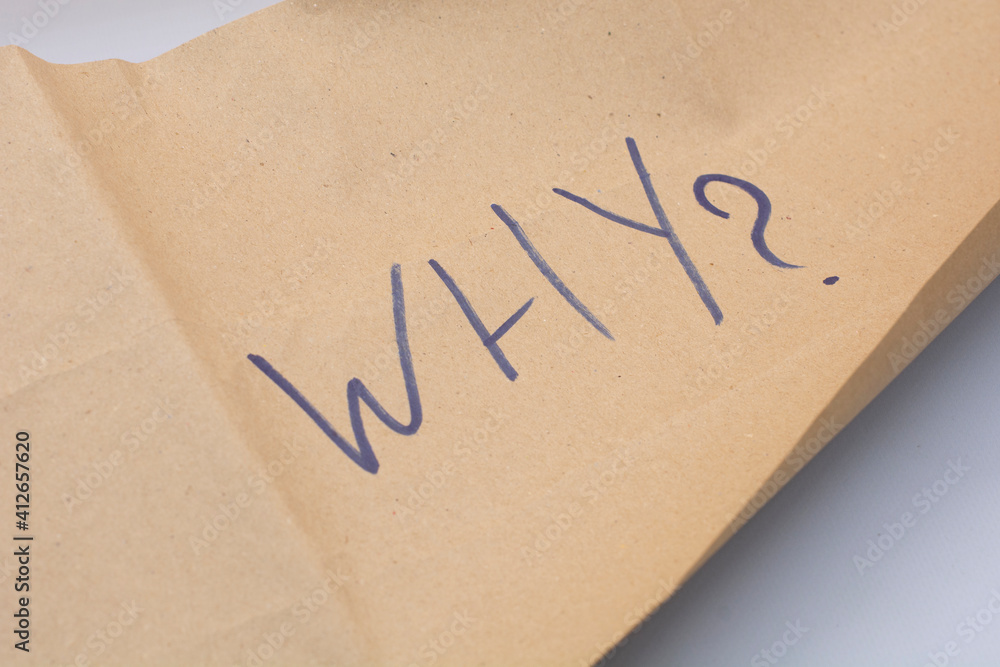 the word why is it written on Kraft paper. motivation and inspiration concept the word why is it written on Kraft paper. motivation and inspiration concept